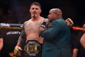 Tom Aspinall with Daniel Cormier after winning the Heavyweight fight at the Co-op Live Arena, Manchester. Picture date: Sunday July 28, 2024.